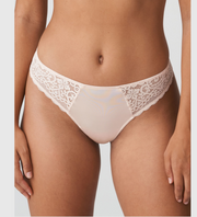 Feminine thong in glossy satin fabric and lace with a vintage pattern.