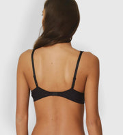 This versatile bra is a wardrobe staple, and one of our most requested styles.  Lightly padded microfibre cups create a lifted, gently rounded shape and smooth profile underneath T-Shirts.   The deeper plunge also accommodates lower necklines and plunges.  With its fun floral detail strap and subtle check pattern, this bra is both practical AND beautiful.