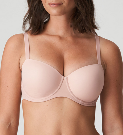 Seamless balcony bra with lightweight padded cups covered in a soft, smooth fabric. 