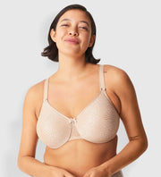This Chantelle seamless, soft molded full-cup bra provides excellent support and a very smooth uplift all the while minimizing any back issues.  The back band and straps are “leotard style”, meaning wide, to encompass and hug the back for a smoother look. There is a pretty “C” detail in the gore part with a small bow.  Match with Chantelle Soft Stretch 